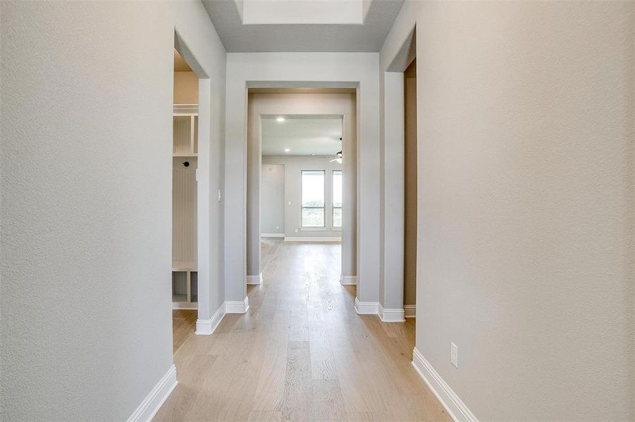 Corridor featuring light hardwood / wood-style flooring