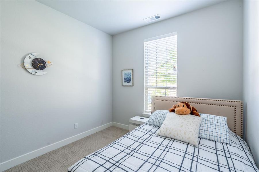 Full bathroom with vanity, shower / tub combo with curtain, and light tile patterned floors