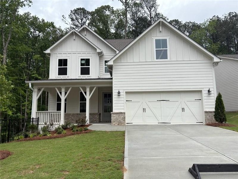 Front exterior of a new home in Riverwood, Dallas, GA, highlighting curb appeal (Image 22).