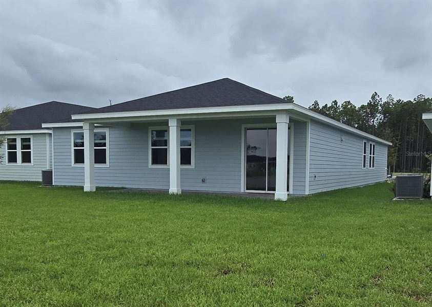Exterior details and patio area of a home in Colbert Landings, Palm Coast (Image 3).