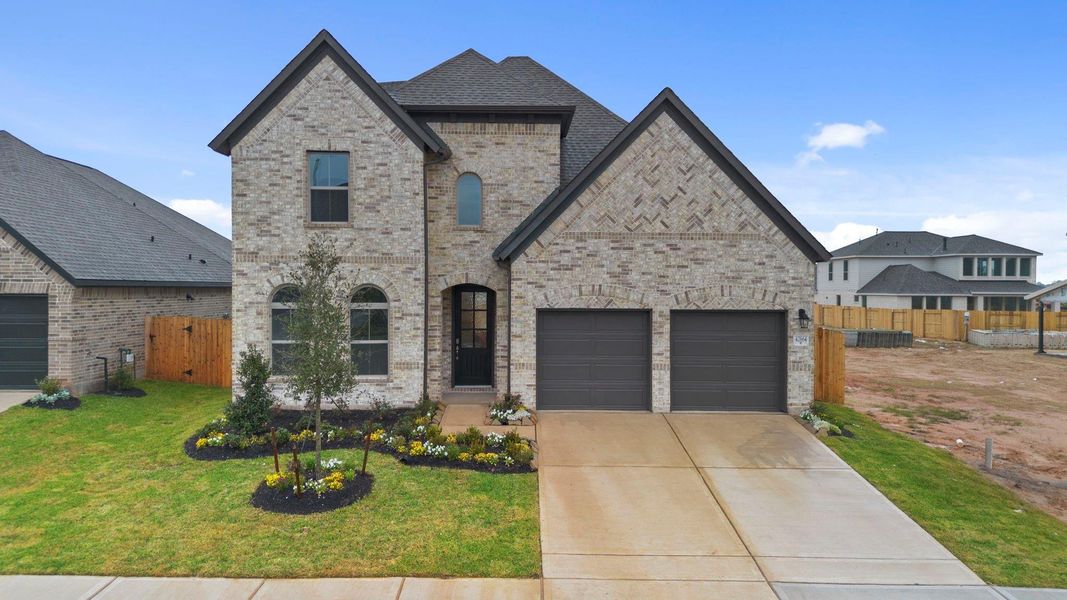 Front exterior of a new home in Escondido, Magnolia, TX, highlighting curb appeal (Image 21).