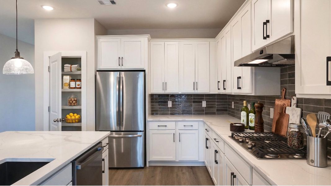 Virtually staged kitchen with accent tile backsplash and large kitchen island