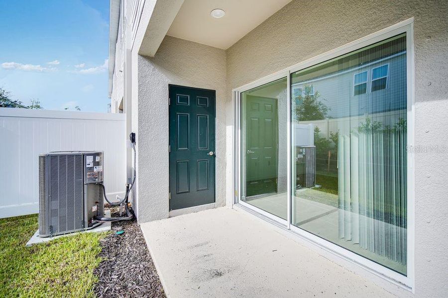Exterior details and patio area of a home in The Townhomes at Skye Ranch, Sarasota (Image 3).