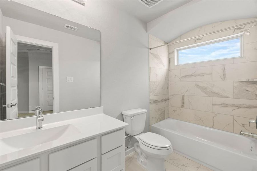 Full guest bathroom. Sample photo of completed home with similar floor plan. Actual colors and selections may vary.