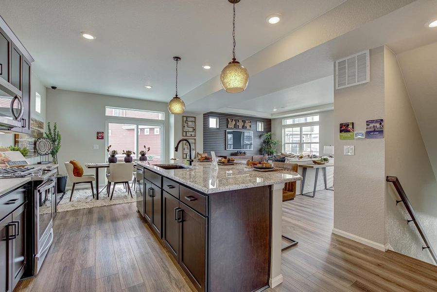 Adjacent to the kitchen, the dining room offers a seamless transition for hosting memorable gatherings, with a sliding glass door leading to a deck where you can dine al fresco or simply soak in the sunshine.