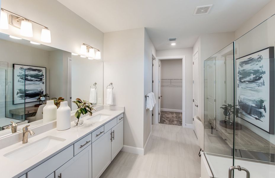 Owner's bathroom with dual vanities and access to Owner's bathroom with dual vanities and access to