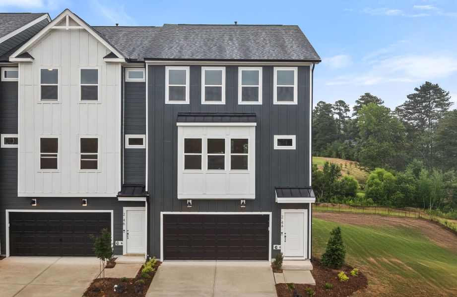 Front exterior of a new home in Prestwick, Apex, NC, highlighting curb appeal (Image 1).