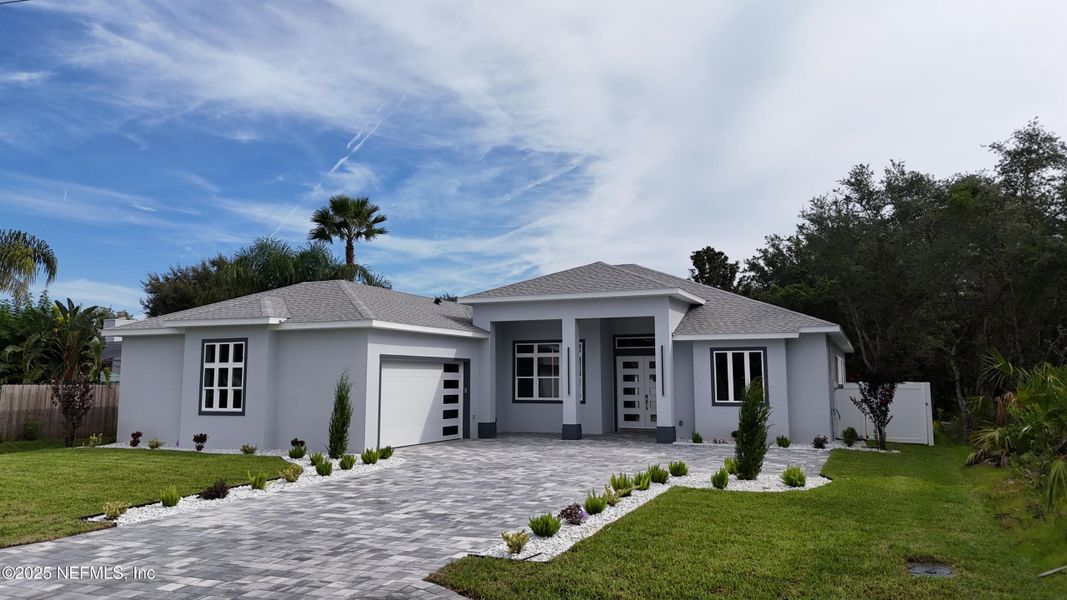 Front exterior of a new home in , Palm Coast, FL, highlighting curb appeal (Image 35). Front exterior of a new home in , Palm Coast, FL, highlighting curb appeal (Image 35).