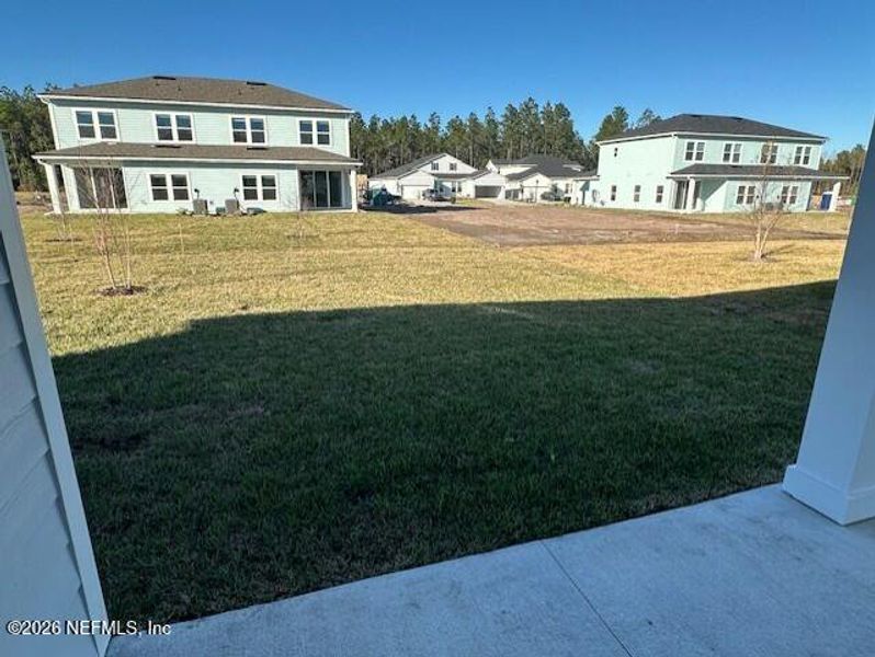 Exterior details and patio area of a home in Brook Forest - Townhomes, St. Augustine (Image 3).