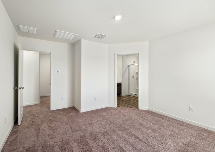 The master bedroom seamlessly connects to the bathroom and closet.