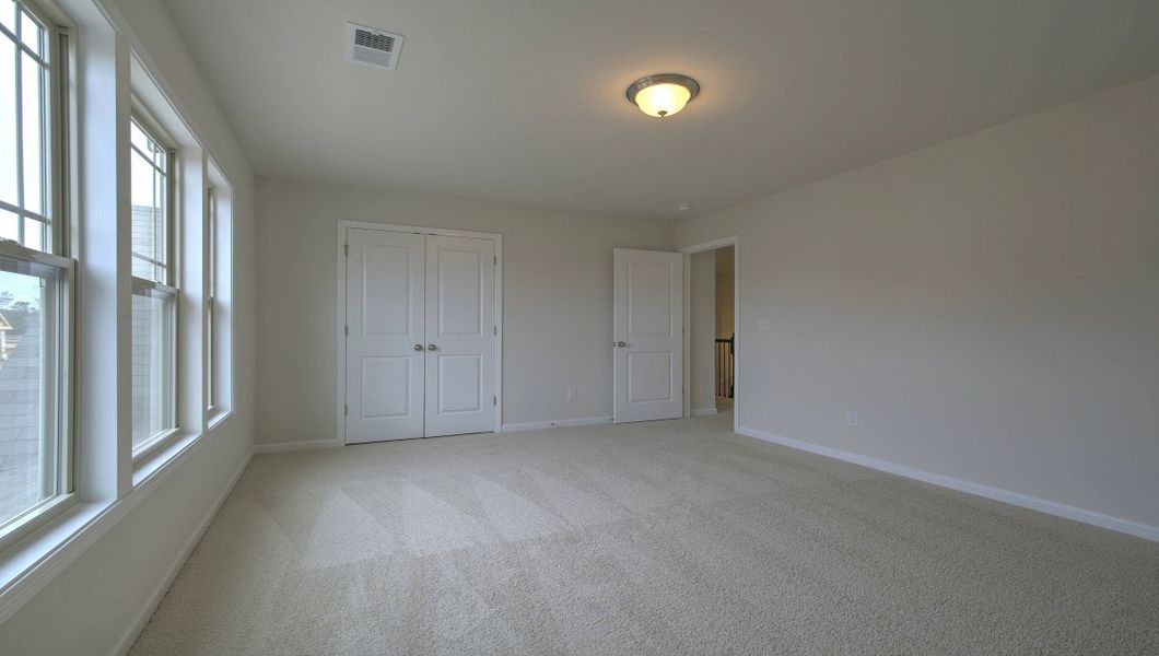 Spacious, unfurnished interior of a new home in Reserve at Tap Root Farms, Fletcher (Image 35).