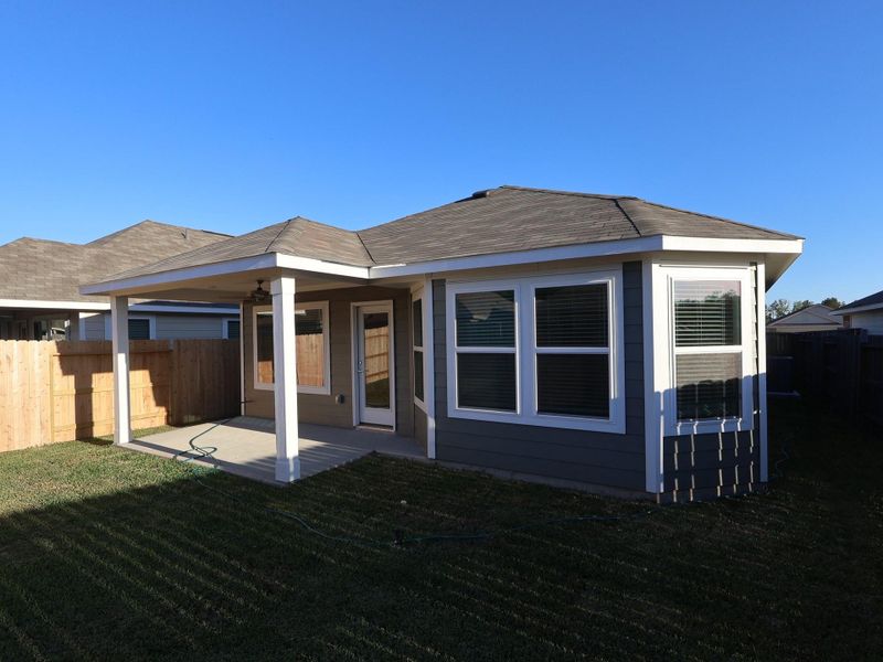 Exterior details and patio area of a home in Pinewood at Grand Texas, New Caney (Image 4).