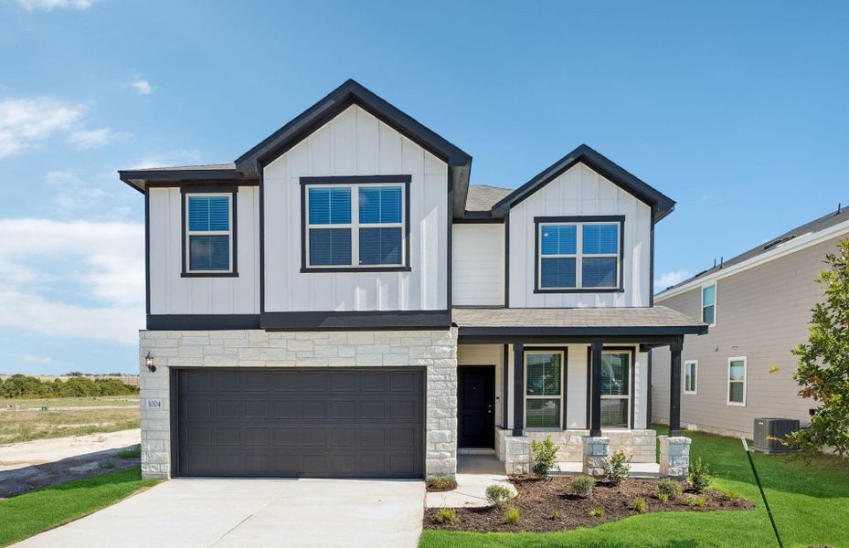 Front exterior of a new home in Sonterra, Jarrell, TX, highlighting curb appeal (Image 18). Front exterior of a new home in Sonterra, Jarrell, TX, highlighting curb appeal (Image 18).