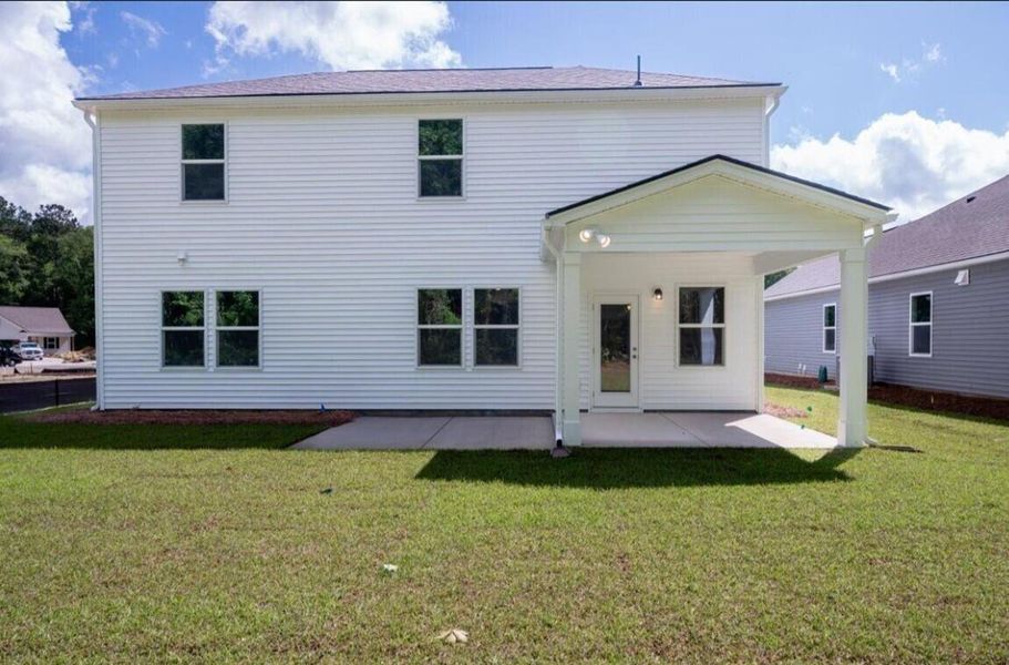 Front exterior of a new home in Cedar Glen Preserve, Huger, SC, highlighting curb appeal (Image 1). Front exterior of a new home in Cedar Glen Preserve, Huger, SC, highlighting curb appeal (Image 1).