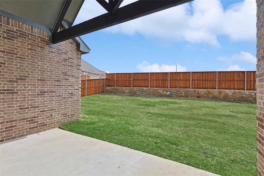 Fenced backyard featuring a patio area