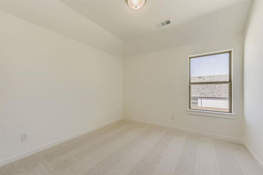 Unfurnished room featuring light colored carpet and baseboards Unfurnished room featuring light colored carpet and baseboards