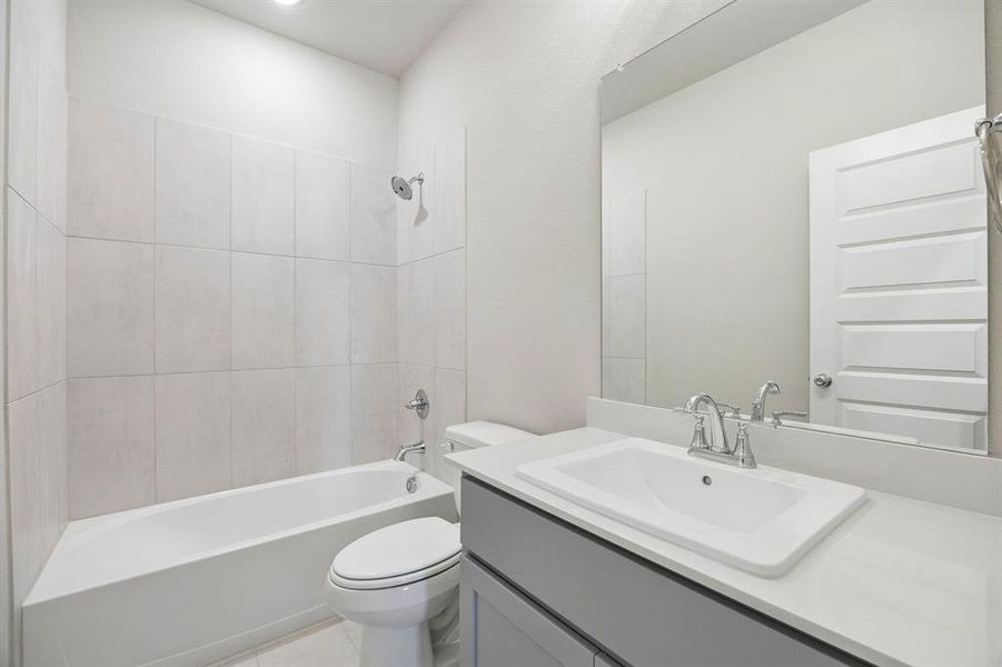 Bathroom in the Emmy II home plan by Trophy Signature Homes - REPRESENTATIVE PHOTO