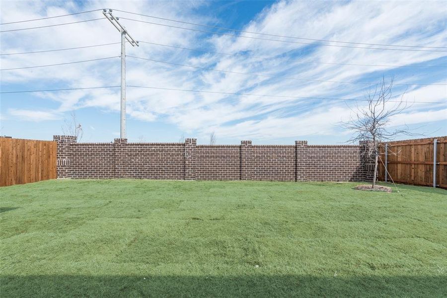 Front exterior of a new home in Sutton Fields, Celina, TX, highlighting curb appeal (Image 14).