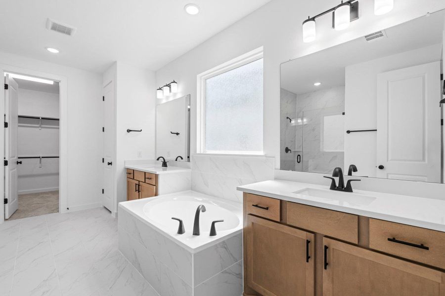 Primary Bath retreat with dual vanities & garden tub