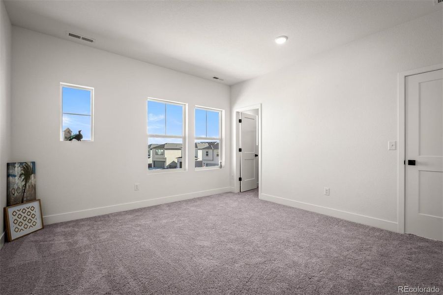 Spacious, unfurnished interior of a new home in Revel Crossing at Wolf Ranch - The Panorama Collection, Colorado Springs (Image 20).