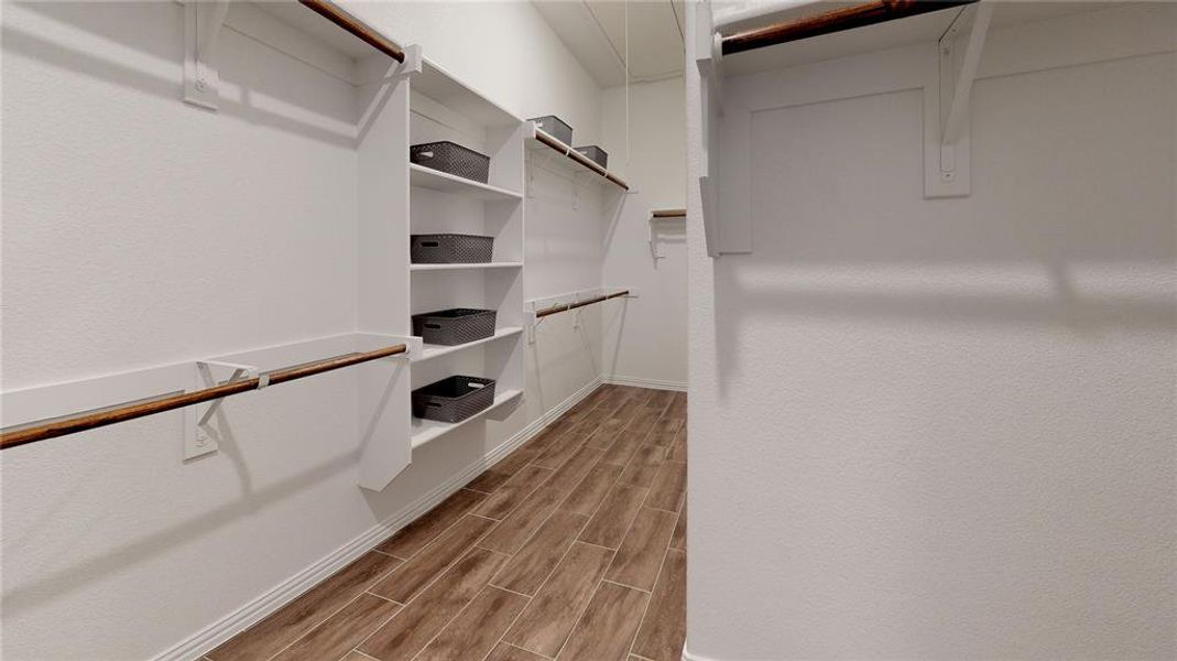 Walk in closet featuring wood tiled floors