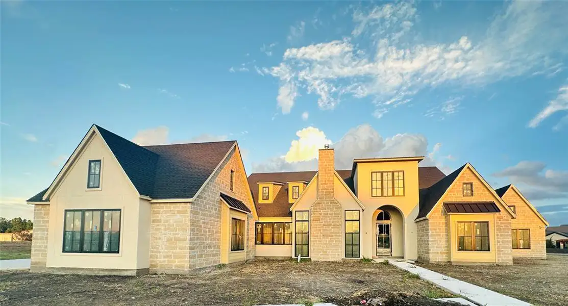 The oversized four-car garage adds approximately 1,550 square feet of covered space. A single bay garage enters a private wing making this flexible space ideal for guests or multigenerational living. The oversized four-car garage adds approximately 1,550 square feet of covered space. A single bay garage enters a private wing making this flexible space ideal for guests or multigenerational living.