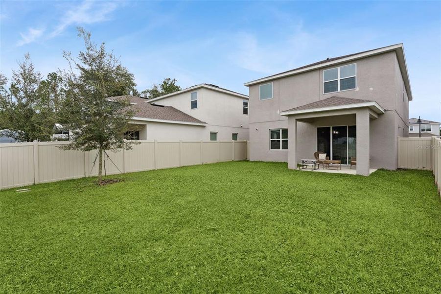 Exterior details and patio area of a home in San Sebastian Reserve, Apopka (Image 18).