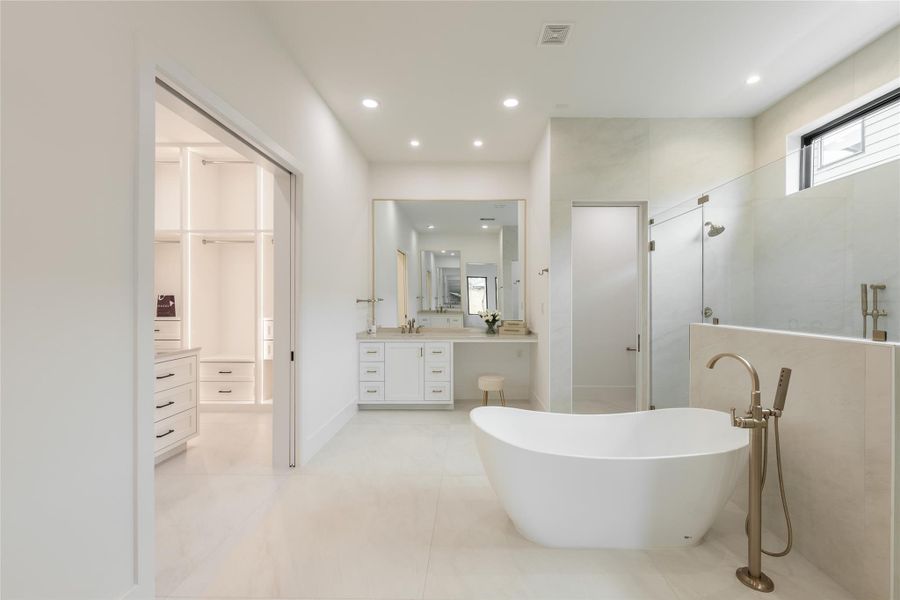 A spacious bathroom with both a soaking tub and walk in shower