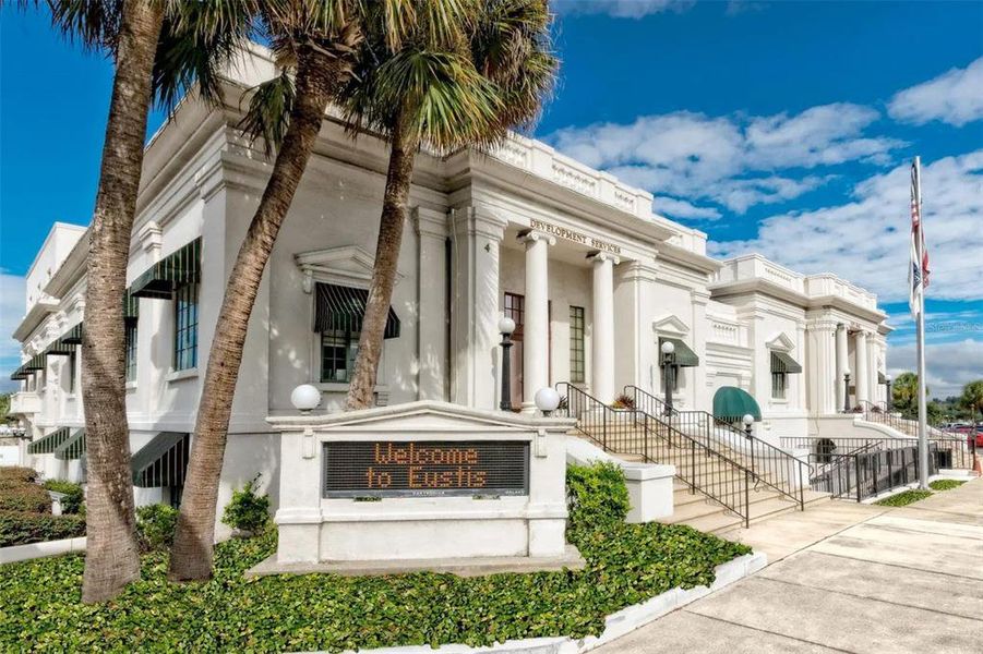 Front exterior of a new home in Pine Meadows Reserve, Eustis, FL, highlighting curb appeal (Image 1).