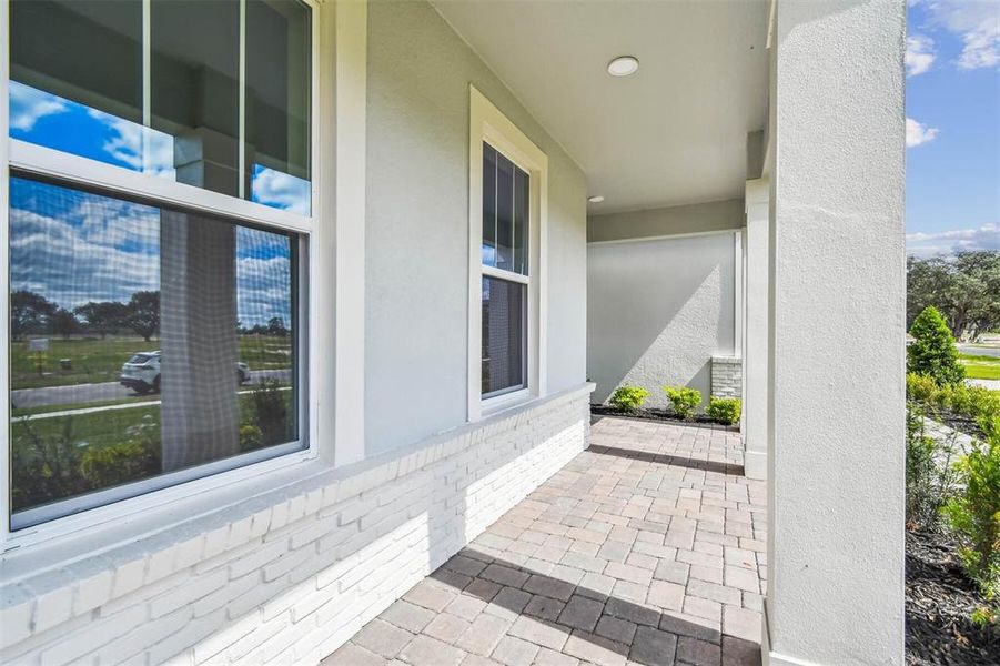 Exterior details and patio area of a home in Solace at Corner Lake, Orlando (Image 40).