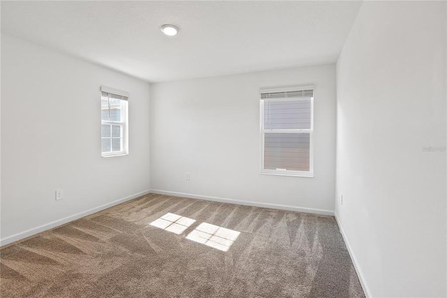 Spacious, unfurnished interior of a new home in Storey Creek: Manor Collection, Kissimmee (Image 38).