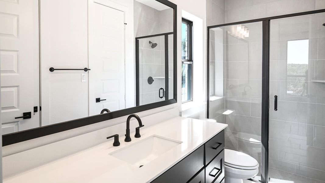 Full bathroom with vanity and a stall shower Full bathroom with vanity and a stall shower