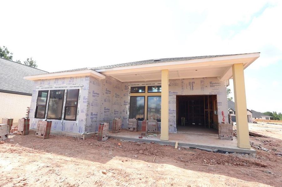 Front exterior of a new home in Kresston, Magnolia, TX, highlighting curb appeal (Image 1).
