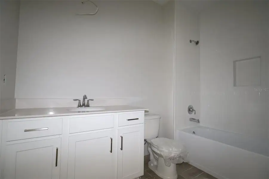 Furnished interior view inside a new home in Emerson Pointe, Apopka (Image 6).