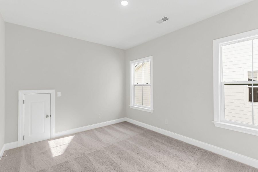 Spacious, unfurnished interior of a new home in Tidewater at Lakes of Cane Bay, Summerville (Image 46).