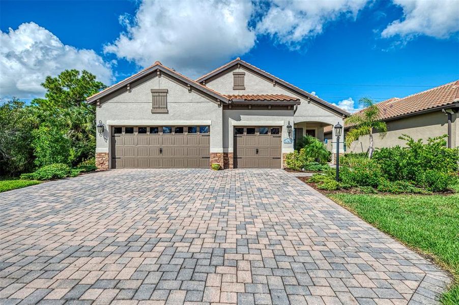 Front exterior of a new home in , Venice, FL, highlighting curb appeal (Image 1).