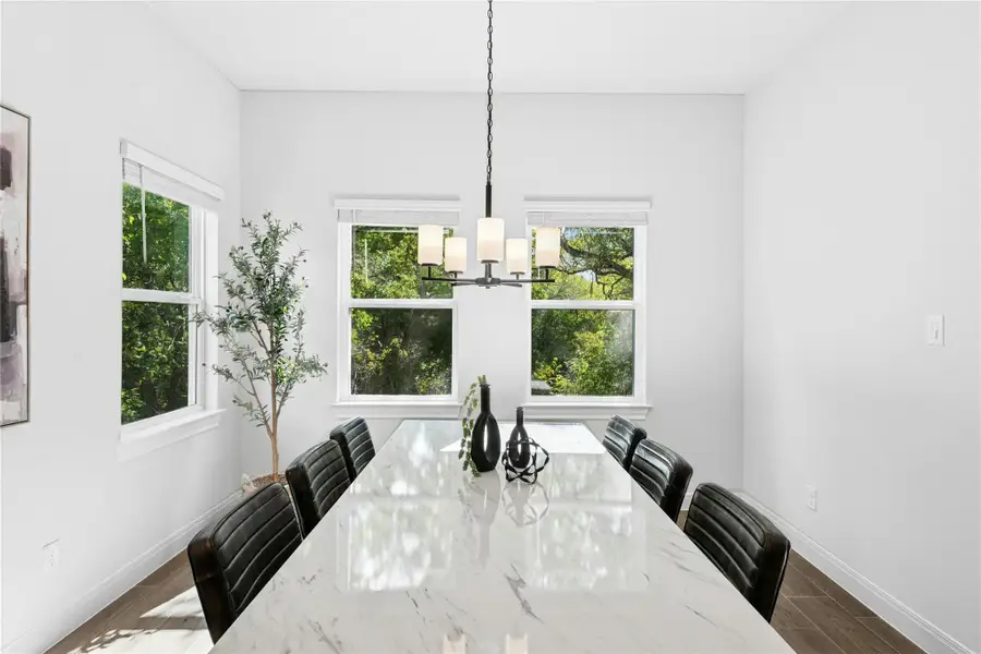 Dining area featuring plenty of natural light and chandeleir Dining area featuring plenty of natural light and chandeleir