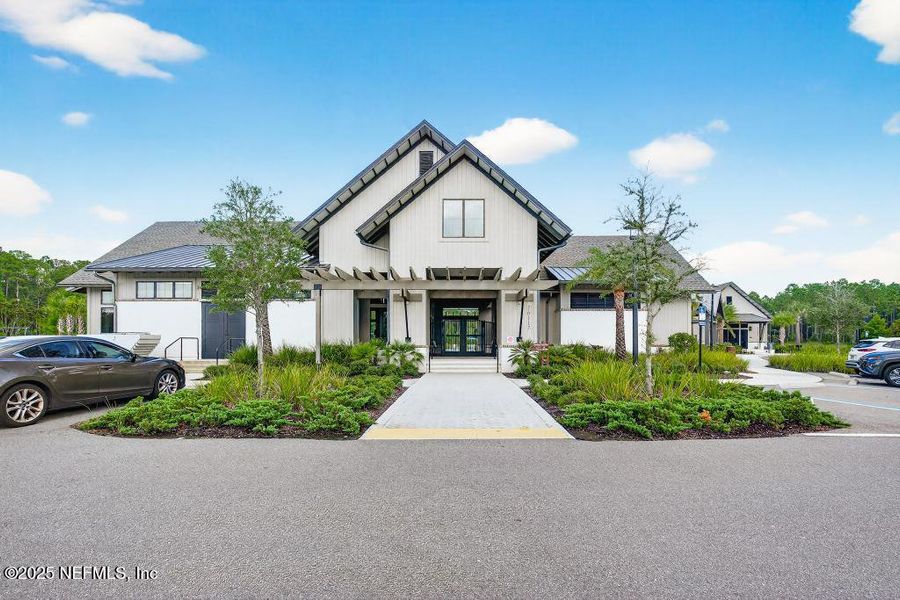 Front exterior of a new home in Tributary, Yulee, FL, highlighting curb appeal (Image 21).