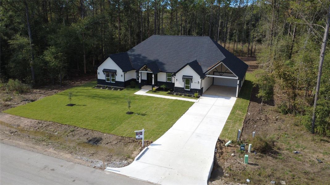 Front exterior of a new home in , Dayton, TX, highlighting curb appeal (Image 25). Front exterior of a new home in , Dayton, TX, highlighting curb appeal (Image 25).