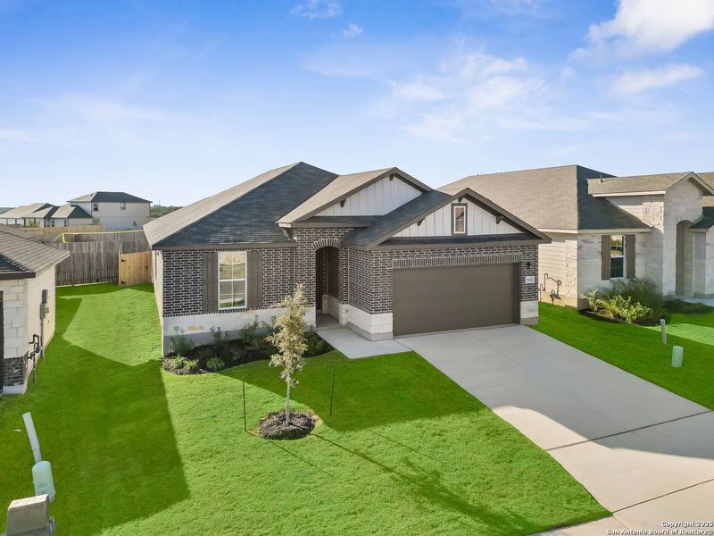 Front exterior of a new home in Morgan Meadows, San Antonio, TX, highlighting curb appeal (Image 2). Front exterior of a new home in Morgan Meadows, San Antonio, TX, highlighting curb appeal (Image 2).