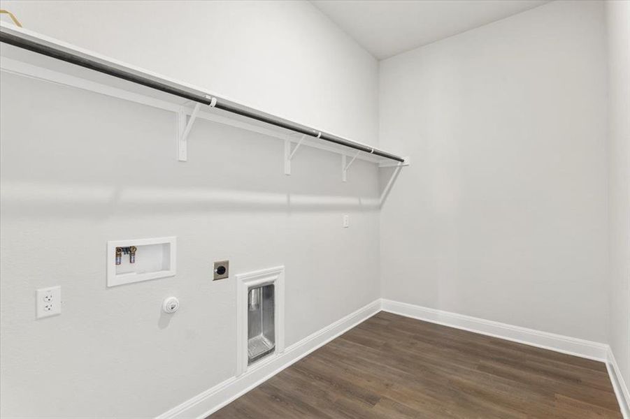 Laundry room featuring gas dryer hookup, dark wood-style flooring, hookup for a washing machine, and electric dryer hookup