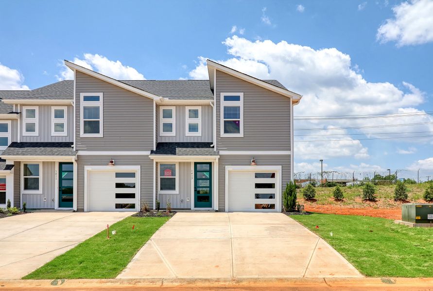 Front exterior of a new home in Westgate Village Townes, Spartanburg, SC, highlighting curb appeal (Image 5). Front exterior of a new home in Westgate Village Townes, Spartanburg, SC, highlighting curb appeal (Image 5).