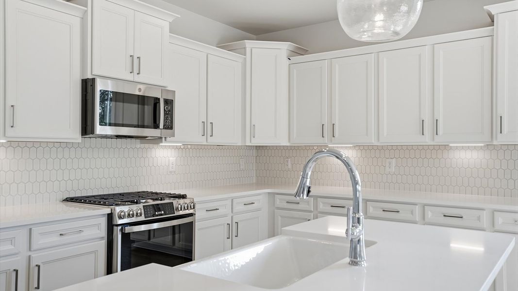 First-class finishes and a thoughtfully scaled island highlight this elegant kitchen space near Lake Hartwell