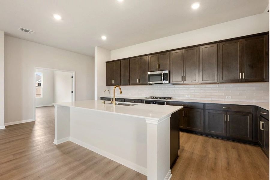 Furnished interior view inside a new home in The Colony 50s, Bastrop (Image 9).