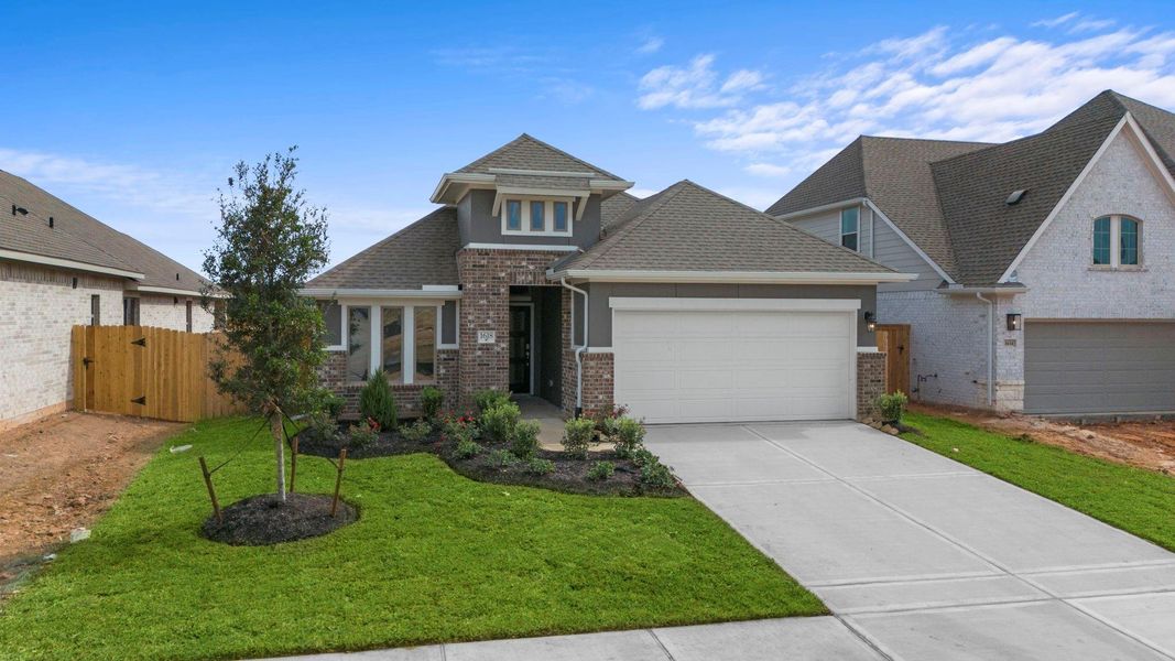 Front exterior of a new home in Escondido, Magnolia, TX, highlighting curb appeal (Image 2).