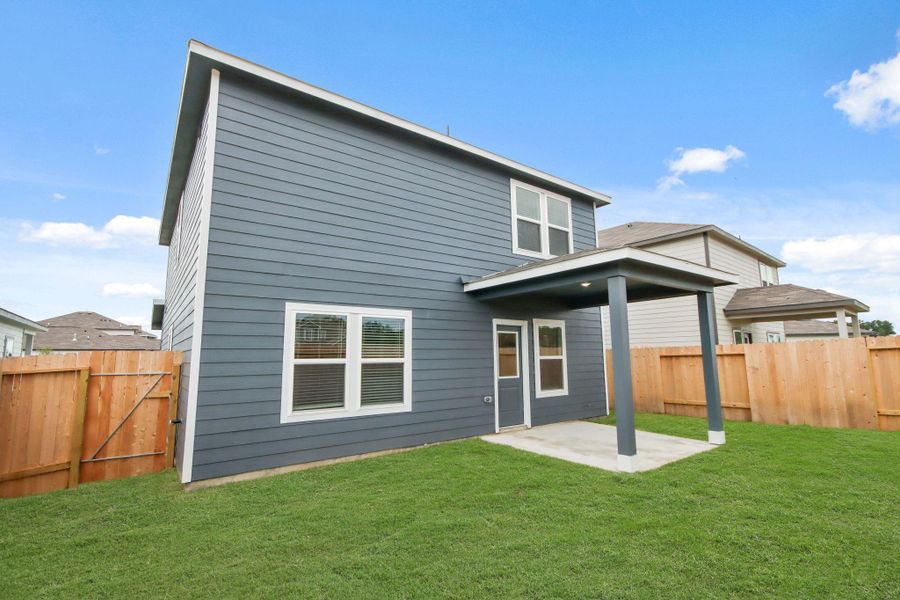 Front exterior of a new home in Northpark South, Porter, TX, highlighting curb appeal (Image 2). Front exterior of a new home in Northpark South, Porter, TX, highlighting curb appeal (Image 2).