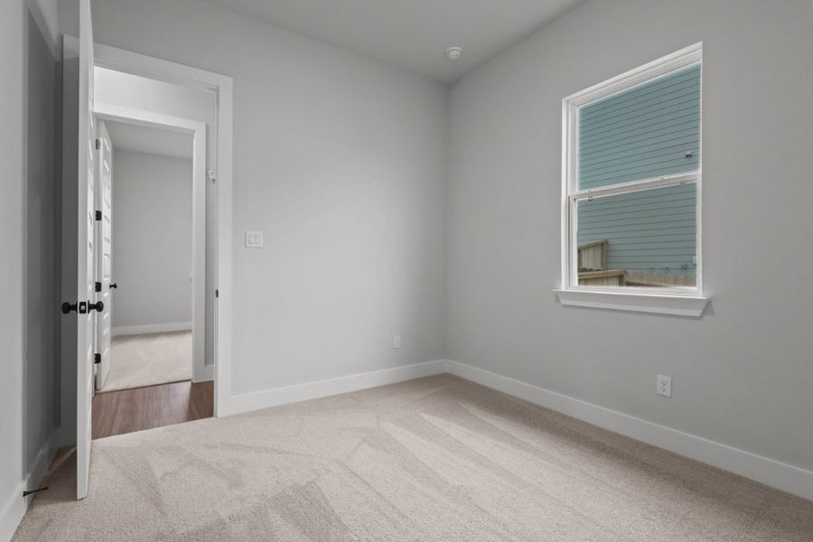 A room with a window and a door. A room with a window and a door.