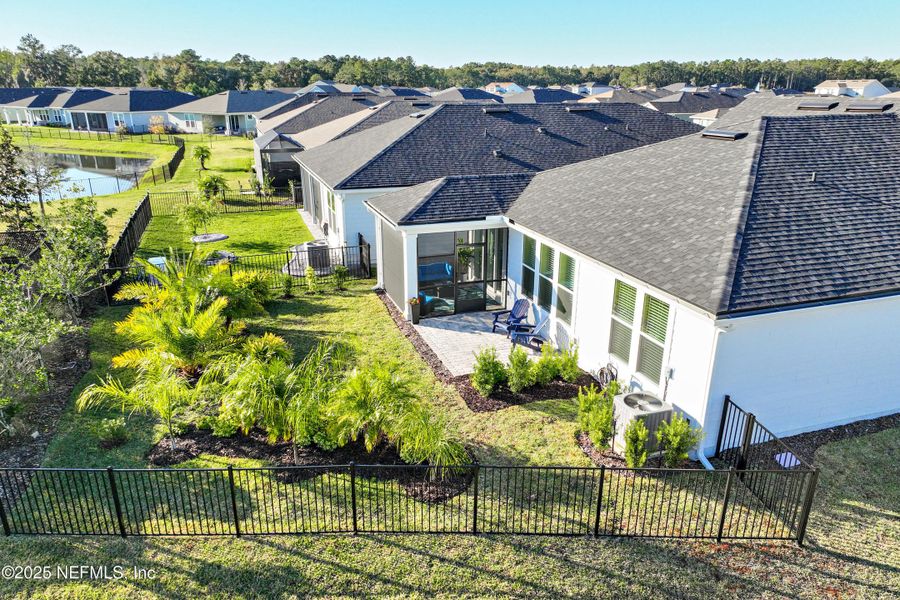 Exterior details and patio area of a home in Summer Bay at Grand Oaks, St. Augustine (Image 27).