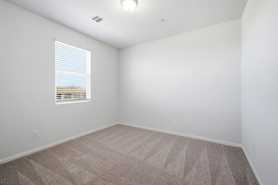 Unfurnished room with light carpet and baseboards