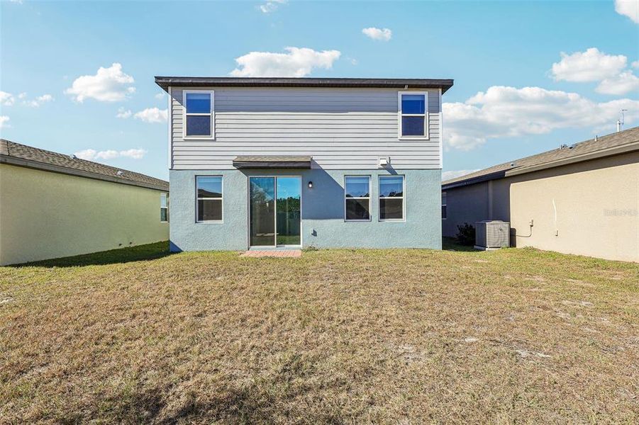 Exterior details and patio area of a home in Lake Deer Estates - Classic Series, Poinciana (Image 17).